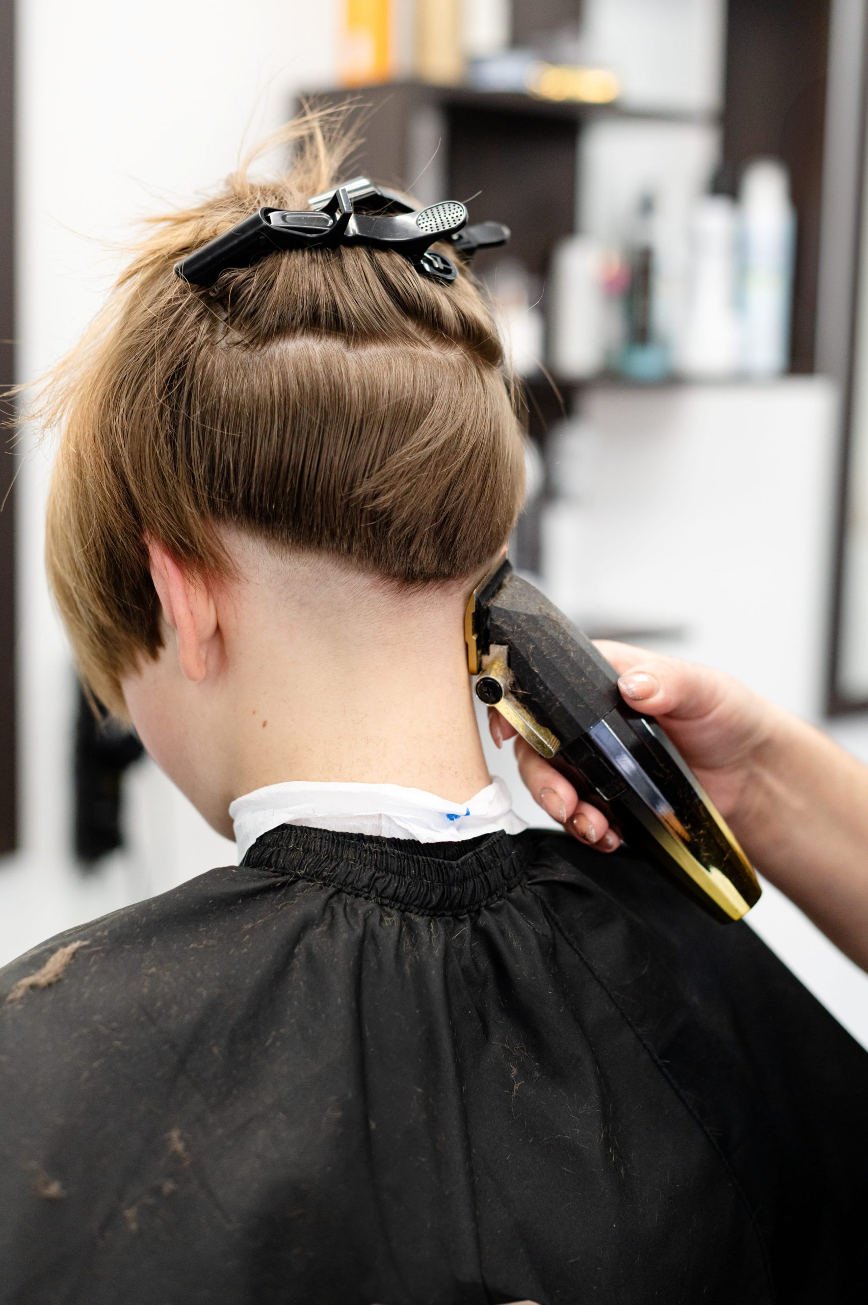 teenager-receiving-a-stylish-haircut-in-a-modern-s-2026-03-25-22-54-35-utc (1)